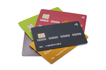 Pile of multicolored credit cards on white background, black card on top