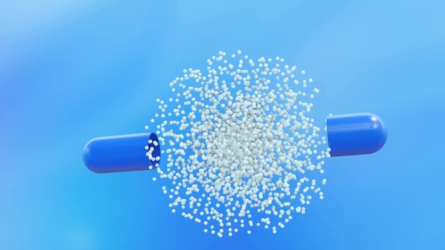 Blue capsule pills are slowly falling on a blue background. Open and out of them flies medicine. Then the capsule closes and the tablet falls further.