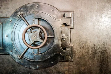 Foto op Canvas Bank safe (strongbox) old lock with wheel on the metal door © Sergei Timofeev