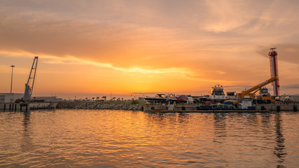 Fototapeta na wymiar Boats in the port docks during sunset