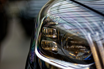 Detail on one of the LED headlights of a car.