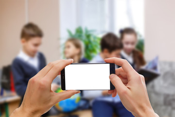 Woman hand hold smart phone, tablet,cellphone on blur