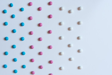 Pile colorful chocolate coated candy background texture pattern