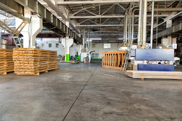 Warehouse of lumber at the woodworking plant. Shop woodworking plant