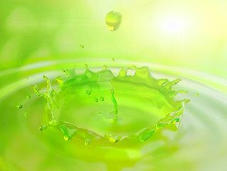 Water drop and wave with reflection green