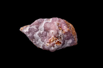 Macro pink Smithsonite mineral stone on microcline on black background
