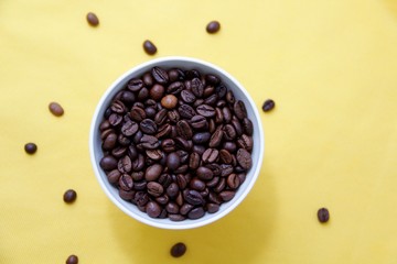 coffee beans in a white cup