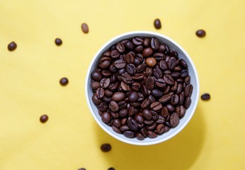 coffee beans in a white cup