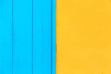 Pastel blue wooden and yellow wall background. Architecture details on Havana, Cuba.