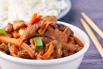 Classic Chinese sweet and sour pork in white bowl