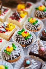 Assortment of pieces of cake on table, copy space. Several slices of delicious desserts, restaurant menu concept