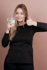 girl drinks milk and is happy