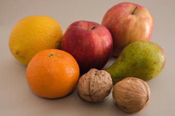 Naklejka na ściany i meble Fruits, apples, oranges, tangerines, pears, walnuts.