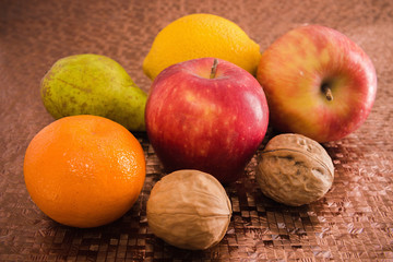 Naklejka na ściany i meble Fruits, apples, oranges, tangerines, pears, walnuts.