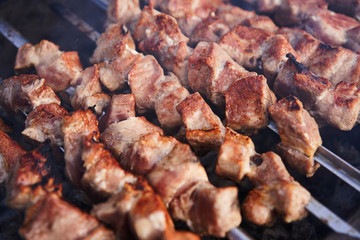 Grilling marinated shashlik on a grill. Shashlik is a form of Shish kebab popular in Europe and other places