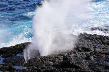 Water bursts through blowhole on Espanola Island, Galapagos National park, Ecuador.
