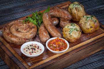  juicy, fried, tender steak with vegetables and sauces on a special stand