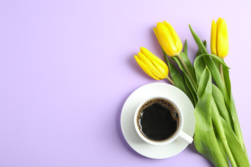 Beautiful bouquet of yellow tulips on color background, top view. Space for text