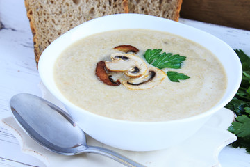 Mushroom cream soup with champignons. Close-up.