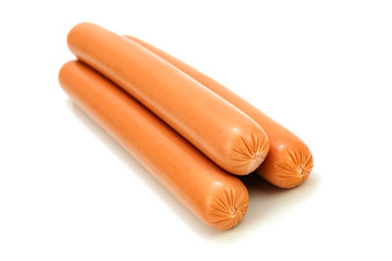 Group of tasty boiled frankfurter sausages decorated on a white background in close-up