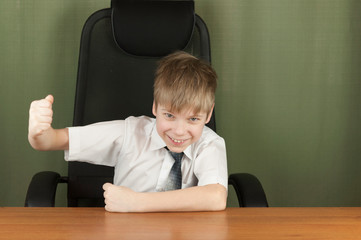 Young business boy. Little boss in office. Funny kids