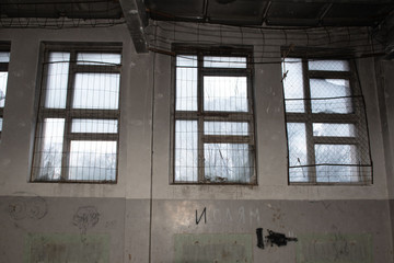 Old, dirty, abandoned gym in an abandoned school