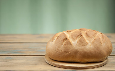 freshly baked sliced bread on wooden table