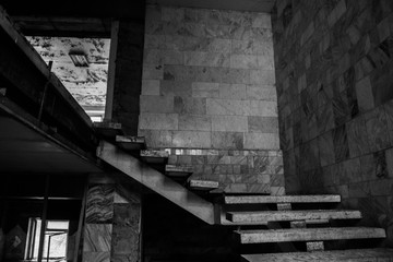 Marble staircase leading to the top. Black and white photo.