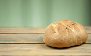 freshly baked sliced bread on wooden table