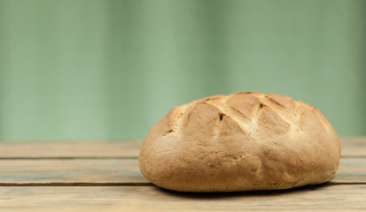 freshly baked sliced bread on wooden table