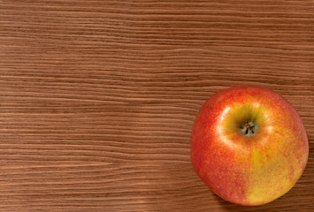 apples on a brown wooden background