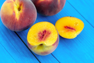 fresh peaches on wooden table