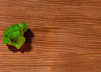 broccoli on brown wooden background