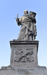 Fototapeta na wymiar Statue of Apostle Paul on the Ponte Sant Angelo. Rome, Italy