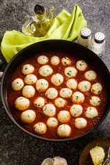 cheese veggie ricotta meatballs in tomato sauce in a pan. traditional Italian cuisine for the whole family, party or restaurant menu