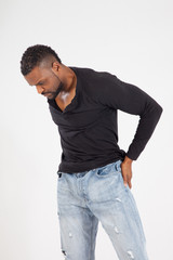 Fototapeta premium Thoughtful Black man in a black shirt and jeans