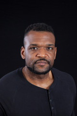 Obraz premium Thoughtful Black man in black shirt