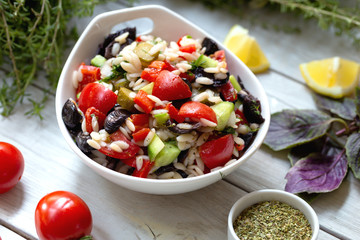 fresh salad with cherry tomatoes and black olives