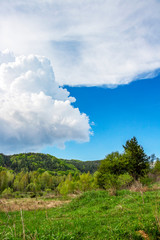 April Bulgarian landscape with beautiful cumulus clouds