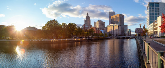 Providence, Rhode Island, United States - October 25, 2018: Panoramic view of a beautiful modern downtown city during a vibrant sunny sunset.