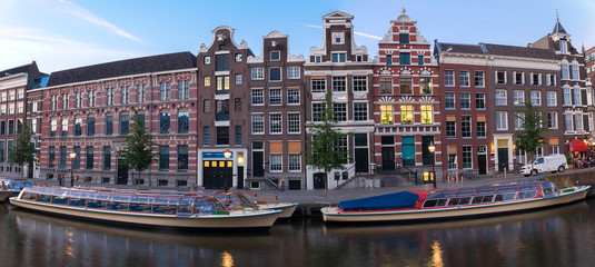 Naklejka premium The city view of Amsterdam canal, typical dutch houses and boats, Holland, Netherlands.
