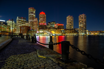 Fototapeta premium Night view of a modern downtown city during night time. Taken in Fan Pier Park, Boston, Massachusetts, United States.
