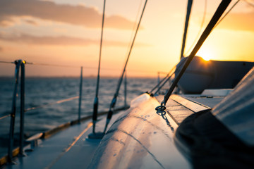 Sailing yacht at sunset in the open sea, weekend on the boat
