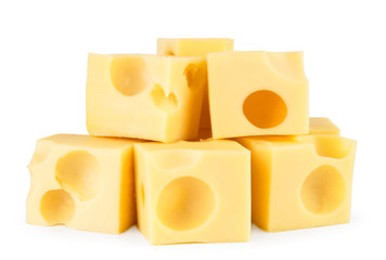Heap of cheese cubes on a white, isolated.