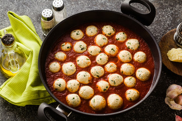 cheese veggie ricotta meatballs in tomato sauce in a pan. traditional Italian cuisine for the whole family, party or restaurant menu