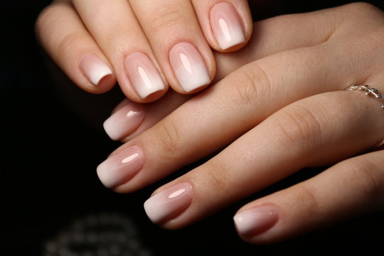 Amazing natural nails. Women's hands with clean manicure.