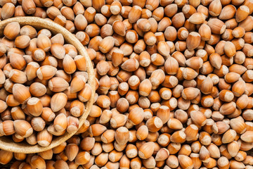 Ripe unpeeled hazelnuts background