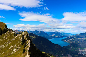 Scenic View of mountains (Niesen) and lake Thun (Thunersee). Interlaken at the end of the Lake.