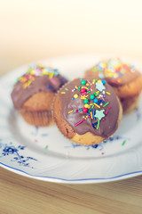 Homemade sweet tasty muffins with colourful decoration