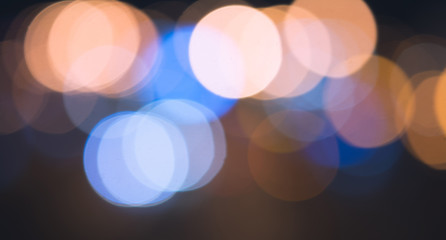 Fototapeta premium Night city bokeh light abstract background, blurred blue flare lens